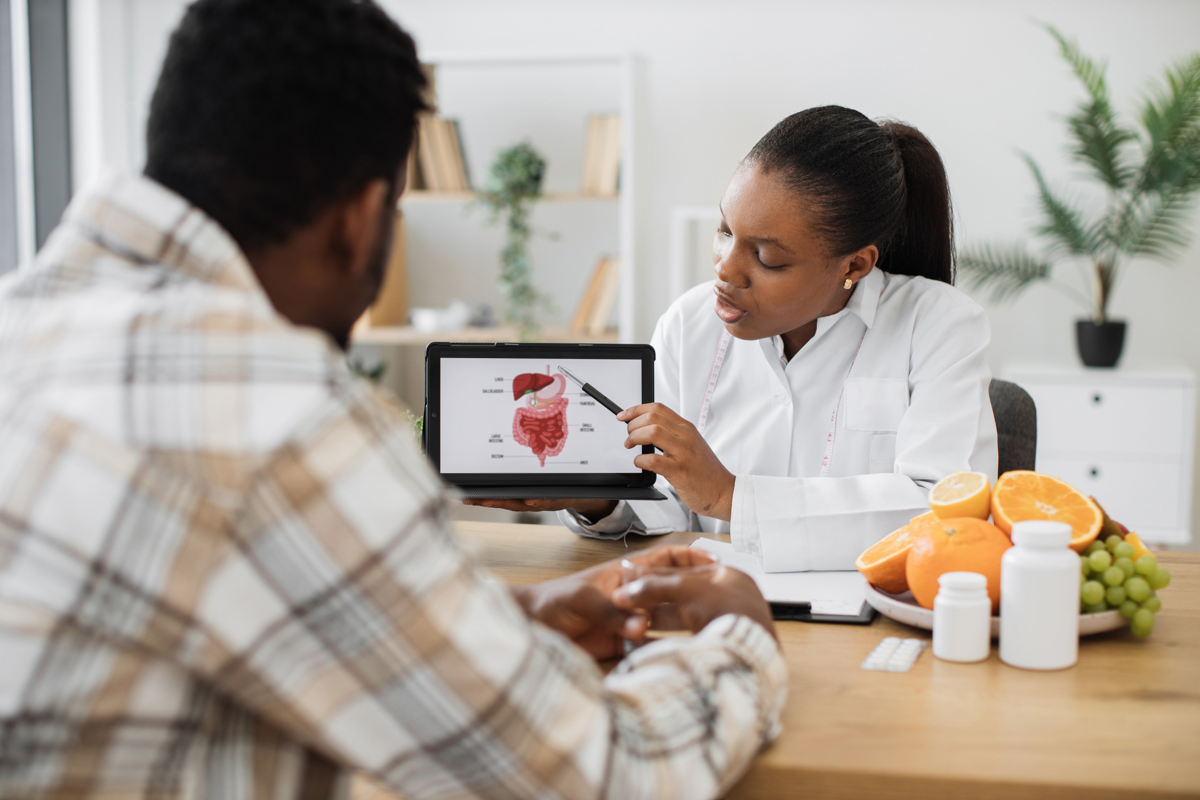 Physician providing information about treatment and options to a patient